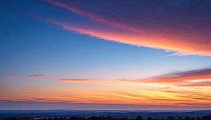 Fototapeta premium Breathtaking Sunset Landscape: Vibrant Orange and Pink Sky Over Rolling Hills - Serene Evening Nature Photography