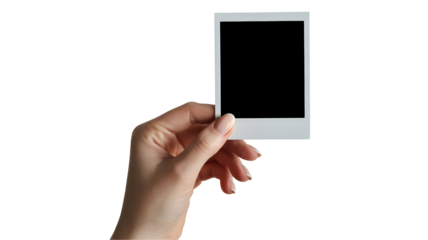 Hand holding a blank white photo frame isolated on transparent background