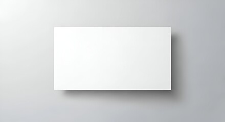 Blank White Poster on Light Gray Wall in Minimalist Interior