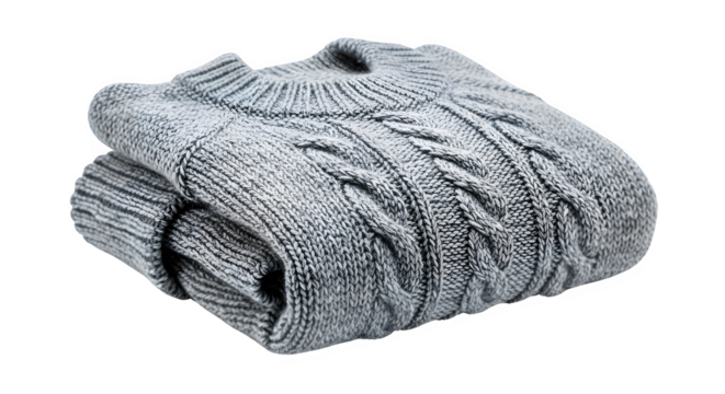 Folded gray knitted sweater with intricate cable patterns, the soft texture and warm tones evoke a sense of comfort and coziness, ideal for fashion or lifestyle imagery - Powered by Adobe