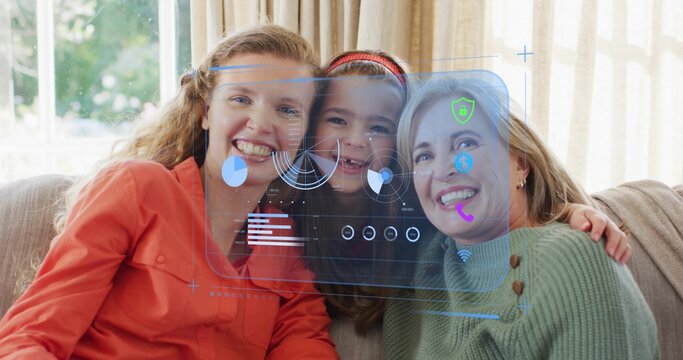 Smiling three-generation family leaning on home sofa wearing orange blouse, showing AR overlay