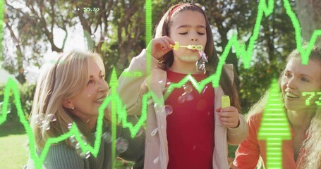 Blowing child in red top making soap bubbles in sunlit park with yellow wand, green overlays