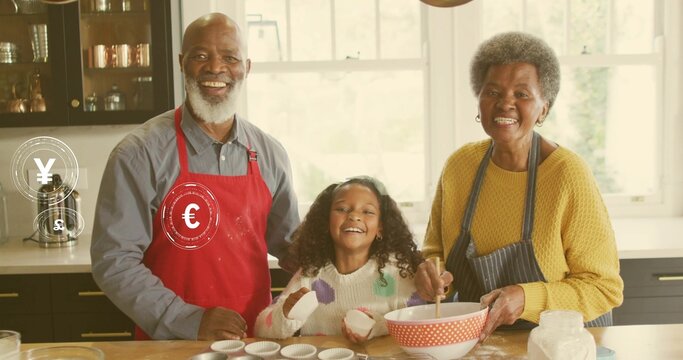 Mixing seniors and grandchild stirring batter at home with polka-dot bowl red apron currency icons