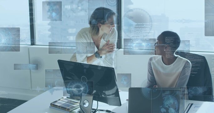 Talking two coworkers leaning listening at office window with monitor laptop HUD white shirt jacket