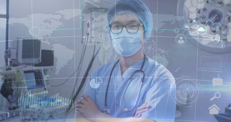Standing surgeon wearing blue scrubs, bouffant cap, mask and stethoscope in OR with AR data