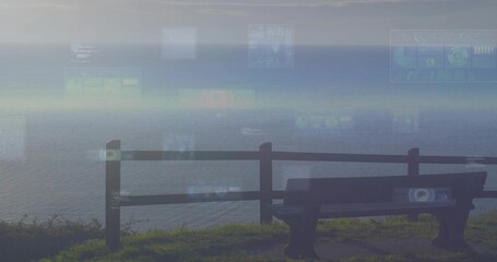 Sitting dark wooden bench facing calm sea on cliff with railing, displaying HUD overlays