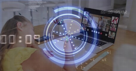 Studying child in yellow eyelet top leaning at kitchen table, viewing laptop, paper, ruler, HUD