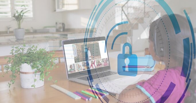 Joining girl wearing pink top, headset viewing laptop with security HUD at dining table, copy space