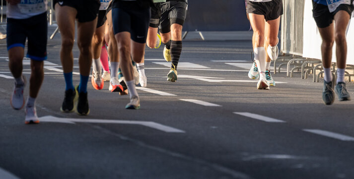 Close up view of diverse marathon runners legs and running shoes outdoors in Ljubljana - Powered by Adobe