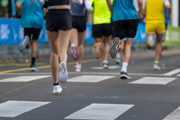 runners competing in an outdoor marathon in Ljubljana showing close ups of legs and running shoes on pavement