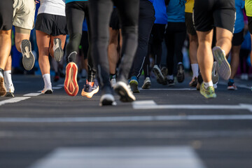 Close up of runners participating in a diverse marathon event outdoors in Ljubljana
