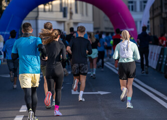 Diverse group of runners taking part in a marathon event in Ljubljana city outdoors