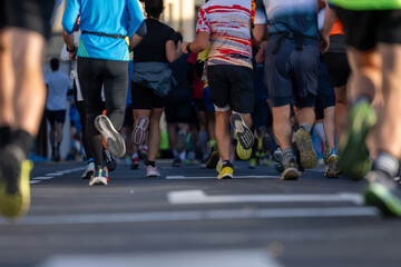 runners in a marathon event in Ljubljana with close up view of their feet on the road