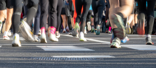 Close up of runners feet in diverse athletic shoes participating in Ljubljana marathon race