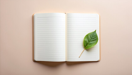Hunger for knowledge and education inspires project symbolized by open notebook and green leaf on beige background