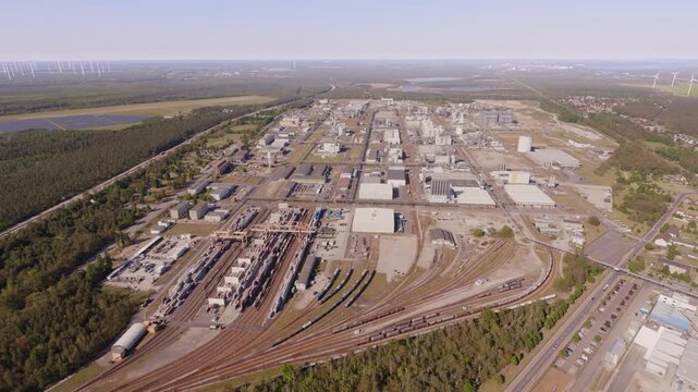 Drone flight over BASF Schwarzheide  with a  large container terminal during nice sunset