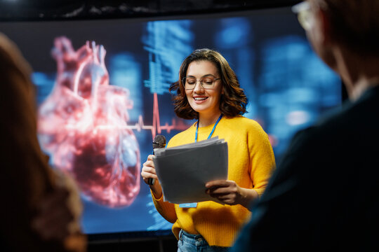 woman is giving a presentation at conference