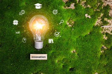 Lightbulb with glowing filament symbolizes innovation, growth, creativity, and futuristic technology on a vibrant green moss background