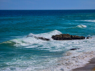 waves crashing on rocks