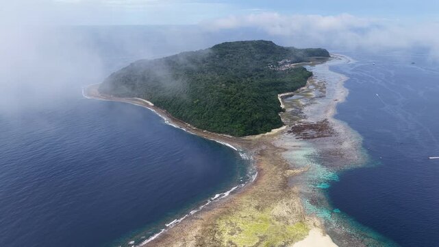 A beautiful coral reef fringes the island of Rhun in the remote Banda Islands of Indonesia. This region is home to spectacular marine biodiversity and is a destination for divers and snorkelers.