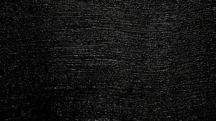 Dark textured surface with subtle linear patterns and granular details, abstract background illustration.