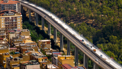 Fototapeta premium Aerial view of a construction site on a road bridge. Work in progress on the highway.