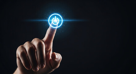Close-up of a person's index finger touching a glowing blue digital power button on a dark background.
