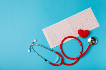 Medical stethoscope, red heart, and cardiogram on a color background. ECG, Heart wave, heart attack, cardiogram report. Cardiogram pulse trace and heart concept. Healthcare.Space for text