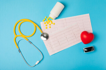 Medical stethoscope, red heart, and cardiogram on a color background. ECG, Heart wave, heart attack, cardiogram report. Cardiogram pulse trace and heart concept. Healthcare.Space for text