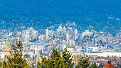 Fototapeta premium Queen Elizabeth Park glows with fiery autumn trees, framing the city and mountains in warm fall colors, Vancouver, BC Canada