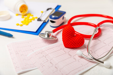Medical stethoscope, red heart, and cardiogram on a color background. ECG, Heart wave, heart attack, cardiogram report. Cardiogram pulse trace and heart concept. Healthcare.Space for text