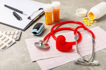 Medical stethoscope, red heart, and cardiogram on a color background. ECG, Heart wave, heart attack, cardiogram report. Cardiogram pulse trace and heart concept. Healthcare.Space for text