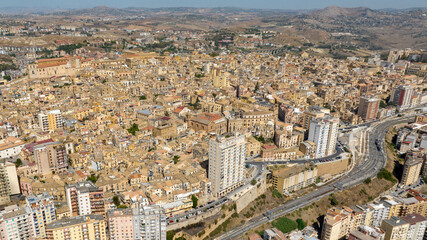 Obraz premium Aerial view of the historic center of Agrigento, Sicily, Italy. This Sicilian capital, located on a hilltop, was known in ancient times as Akragas. It's a beautiful, sunny summer day.