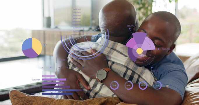 Adult son hugging father on sofa, showing comfort while HUD charts animating over torsos for health