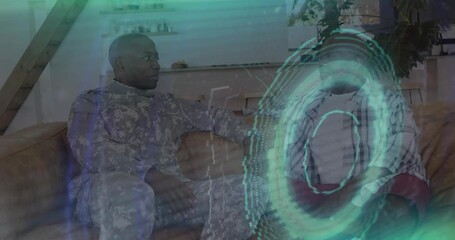 Soldier chatting on sofa, causing teal overlays covering person growing beard, discussing health