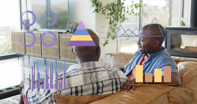 Son turning and speaking, presenting finance rings, pyramid and bars updating while dad listening