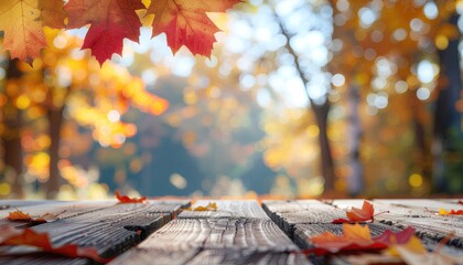 Vibrant autumn leaves frame a rustic wooden surface with a bokeh background, ideal for seasonal