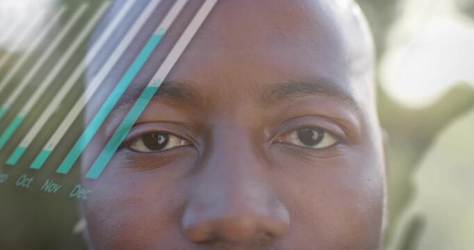 Man opening eyes, smiling as HUD bar chart and circular infographic animate, showing data insight