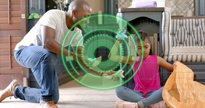 Dad giving items girl reaching and sorting for recycling by orange bag with green HUD