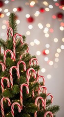 Close up of a small Christmas tree covered in traditional red and white striped candy canes, surrounded by holiday sparkle and winter cheer, stripe, close up, joyous