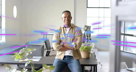 Man sitting desk in office, magenta or cyan streaks crossing scene causing forward look and smile - Powered by Adobe