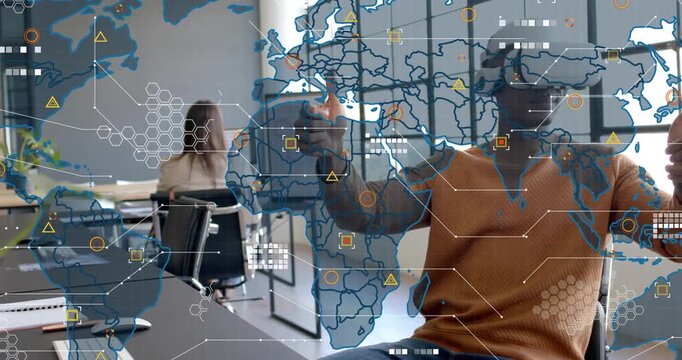 Man putting on VR headset in open-plan office, activating map and manipulating nodes for tech test