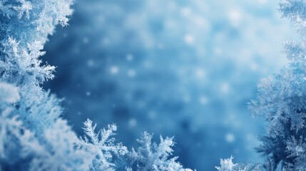 A serene winter background featuring delicate snowflakes against a soothing blue backdrop.