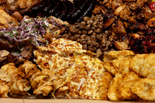 Close-up of supermarket meat display with ready-to-sell products.