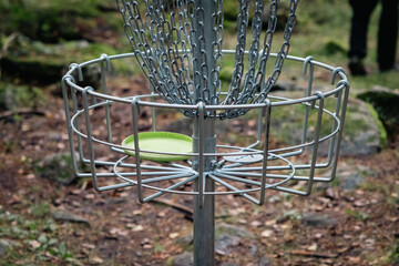 discgolf target and a disc