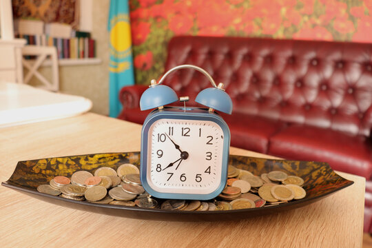 an antique alarm clock on the table