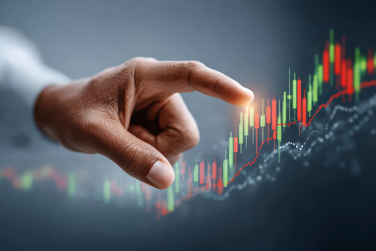 A hand interacting with digital graphs representing financial stock market data, suggesting concepts of investment, analysis, and technology.