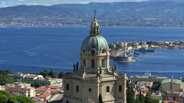 Aerial Drone View over Messina, Sicily, Italy. Tempio di Cristo Re Temple on a Hill over the Harbour on Sunny Day.