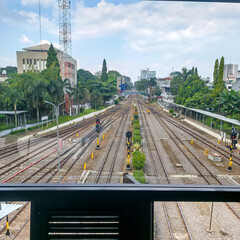 Railway Tracks and Signals in Urban Environment Viewed from Elevated Platform at City Station
