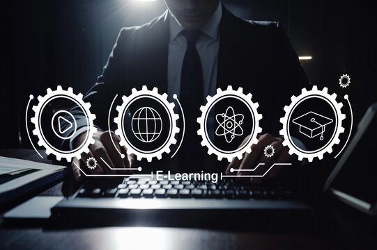 Professional in Suit Working on Laptop in Dark Office with E-Learning Icons for Online Education, Technology, Learning and Digital Transformation Concepts